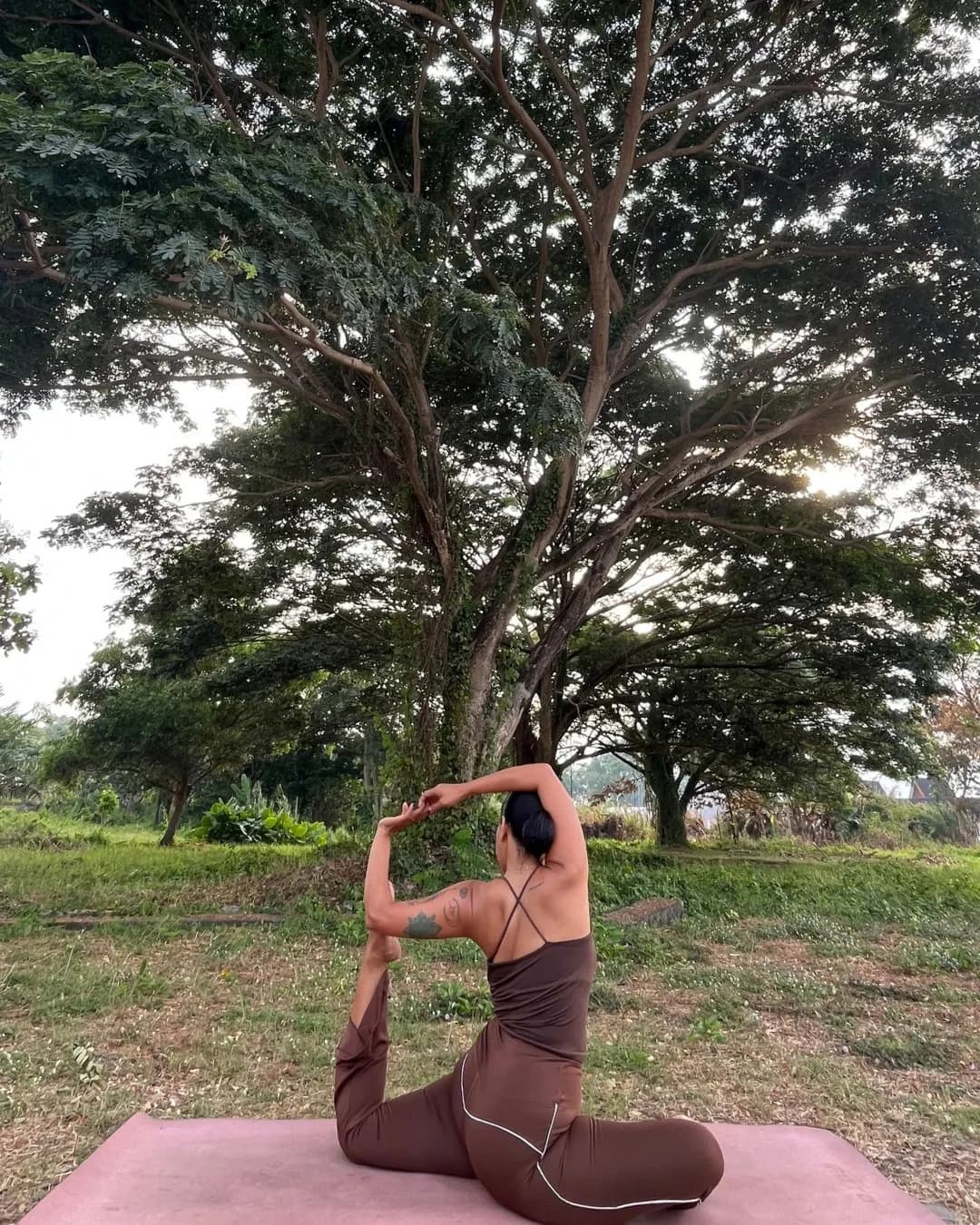 Mermaid Pose with big tree as background